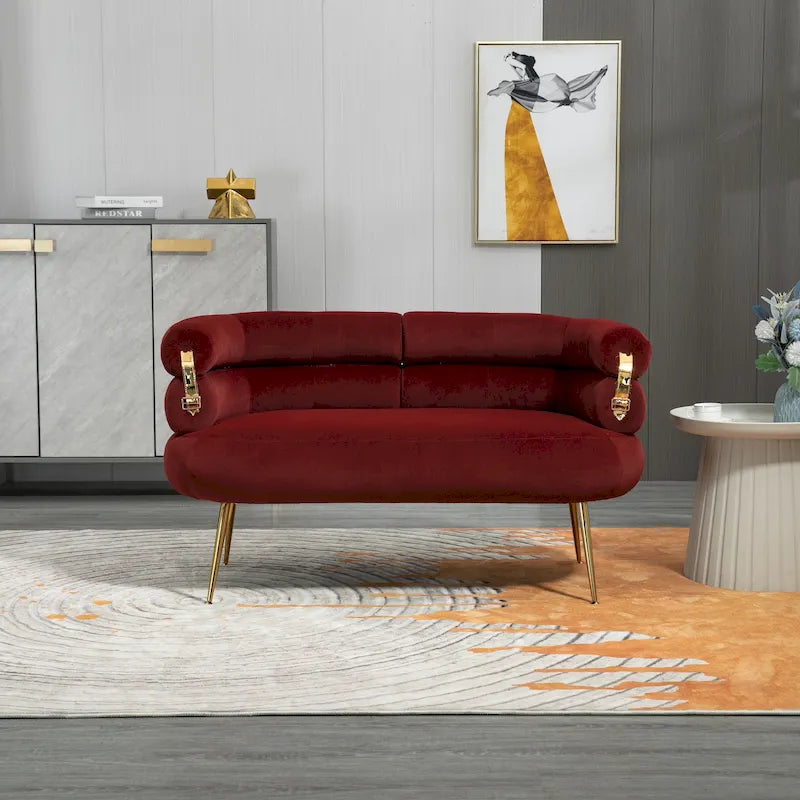 Sillón decorativo tapizado en terciopelo con patas de metal