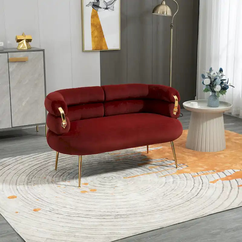 Sillón decorativo tapizado en terciopelo con patas de metal