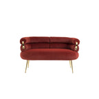 Sillón decorativo tapizado en terciopelo con patas de metal