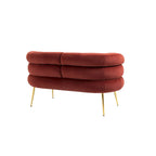 Sillón decorativo tapizado en terciopelo con patas de metal