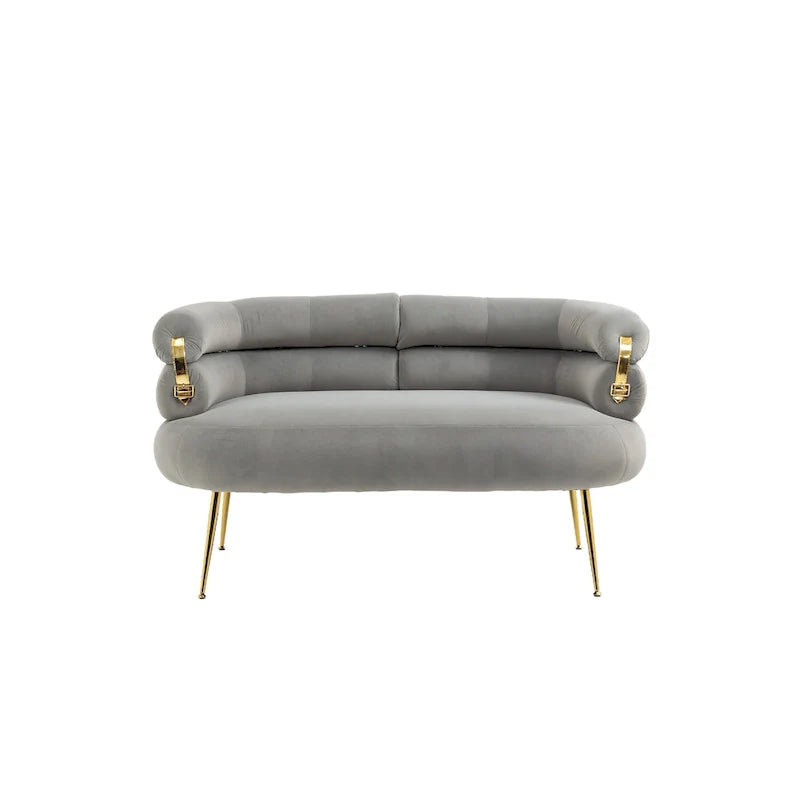 Sillón decorativo tapizado en terciopelo con patas de metal