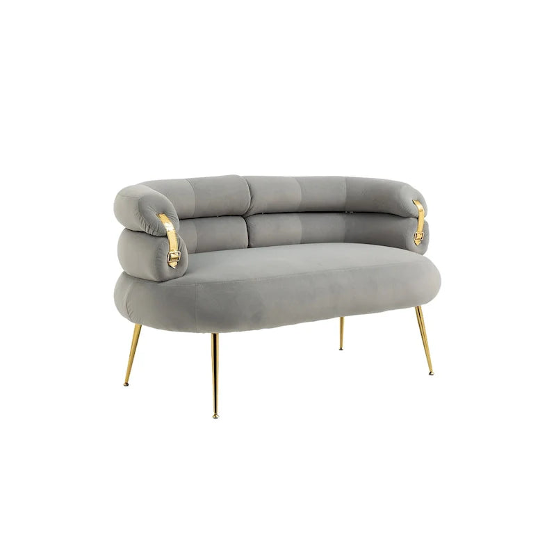 Sillón decorativo tapizado en terciopelo con patas de metal