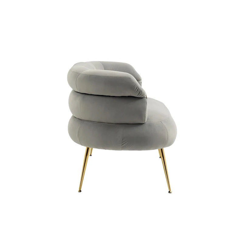 Sillón decorativo tapizado en terciopelo con patas de metal