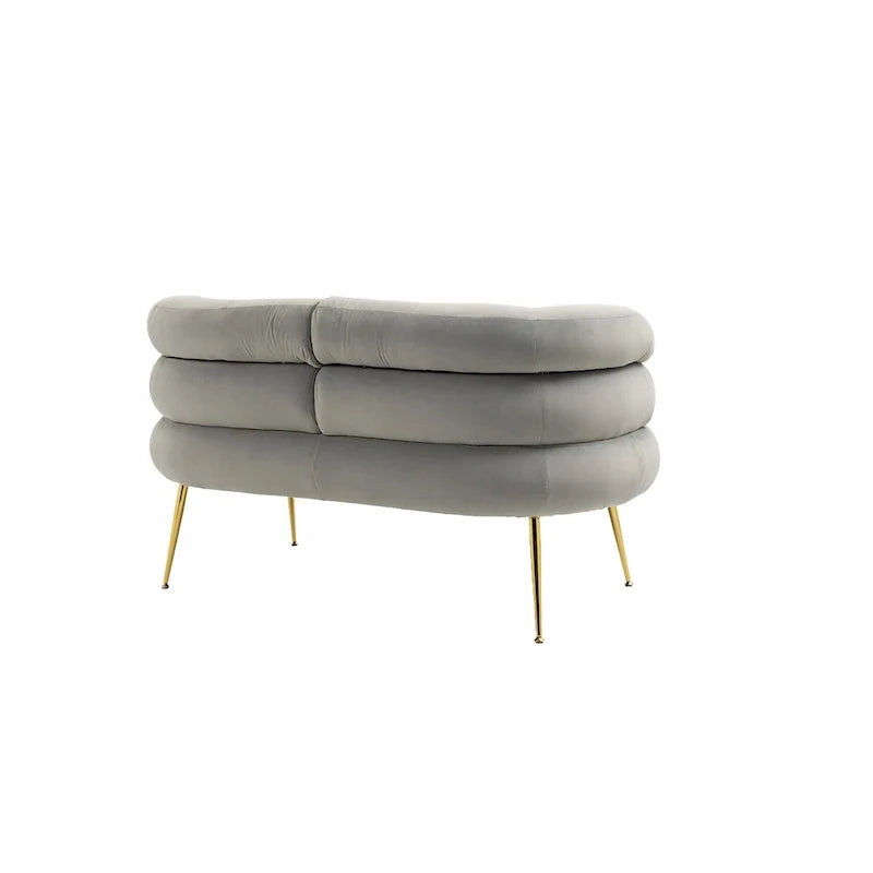 Sillón decorativo tapizado en terciopelo con patas de metal