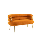 Sillón decorativo tapizado en terciopelo con patas de metal