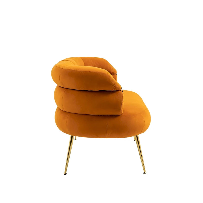 Sillón decorativo tapizado en terciopelo con patas de metal