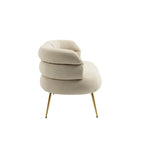 Sillón decorativo tapizado en terciopelo con patas de metal