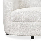 Sillón auxiliar de bucle con brazos curvos modernos, asiento estilo riñón y patas de madera redondas