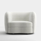Sillón auxiliar de bucle con brazos curvos modernos, asiento estilo riñón y patas de madera redondas